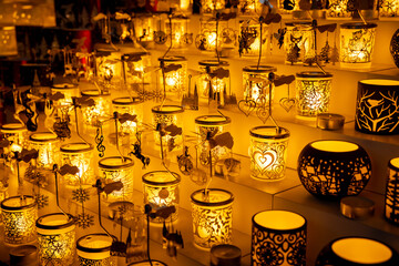 Christmas decoration at the Christmas market fair in the center of European city. Vienna Christmas market on the main square with colorful lights, candles and round balls for decorating fir tree