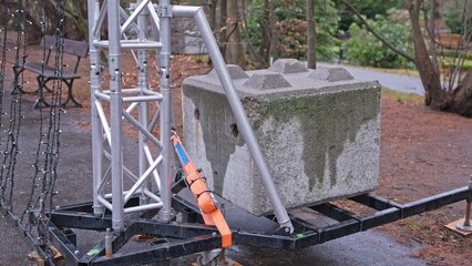 Outdoor Tall Truss Construction Beam Secured with Concrete Block Counter Weight and Flat Polyester...