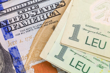 Close-up of one leu notes and united states currency