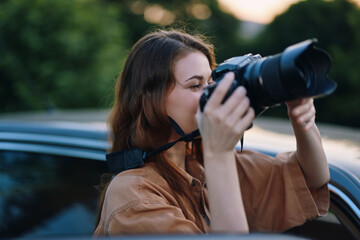 Young female photographer capturing outdoor moments with a professional camera, showcasing a...