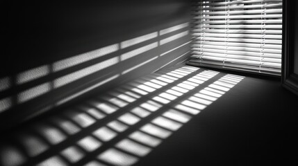 Obraz premium Shadows and light play on a wall from blinds.