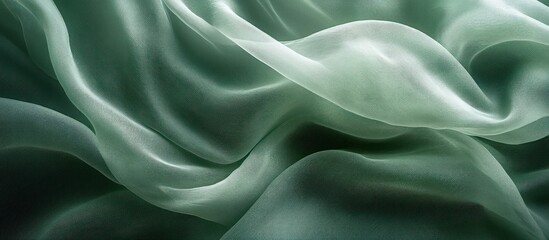 Fototapeta premium Soft, flowing, and delicate fabric with a green tint.
