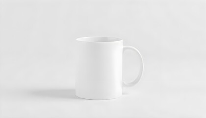 Fototapeta premium A plain white ceramic mug mock-up placed on a clean surface, ideal for showcasing designs or branding in a minimalist style