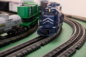 Close-Up of a Model Train on a Curved Track in Motion