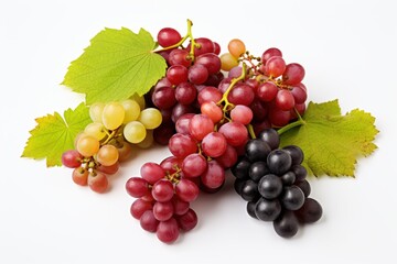 Fototapeta premium Freshly harvested grapes in various colors arranged with green leaves on a clean surface