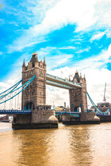 A majestic view of Tower Bridge spanning the River Thames in London. The iconic Victorian-era...