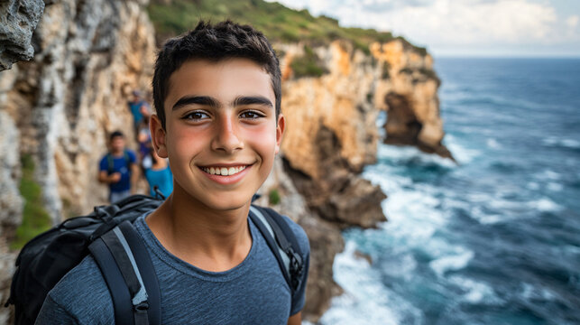 Active teenage boys hiking scenic coastal trail enjoying outdoors friend energy enthusiasm love nature adventurous group outing rocky coast fun field trip path fresh happy smile photography cold - Powered by Adobe