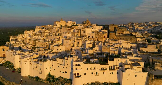 Aerial View Of Ostuni City And Comune At Sunset In Brindisi, Apulia, Italy.