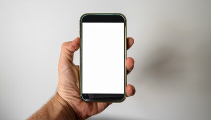 Hand holding a smartphone with a blank screen.
