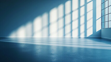 Sunlit empty room with large windows and soft shadows
