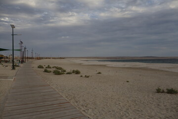 A wooden path to the edge of the beach
