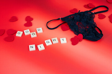 Red hearts and candles on red background with lighting love you letters word text 