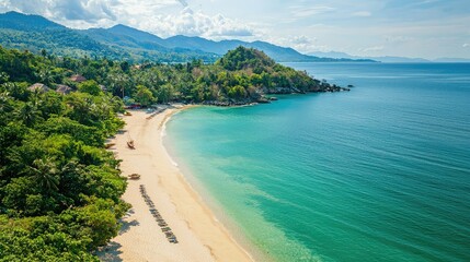 Fototapeta premium Serene Tropical Beach with Clear Water and Lush Green Landscape