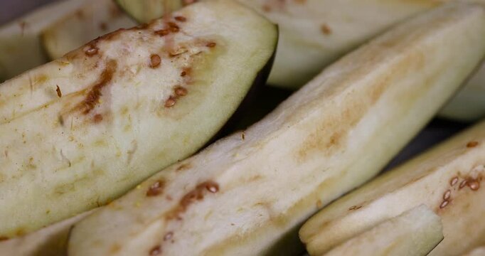 cut lengthwise one eggplant during cooking, the flesh and seeds of sliced ripe eggplant
