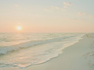 Obraz premium Serene sunset over tranquil beach with gentle waves and clear sky