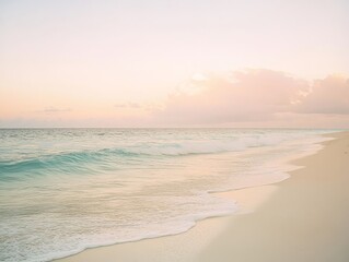 Fototapeta premium Serene beach at sunset with gentle waves and soft pastel sky