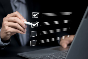 Businessman checklist concept as clipboard document checklist form on the virtual screen Use your...