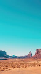 Naklejka premium Stunning Desert Landscape with Mountains and Clear Blue Sky