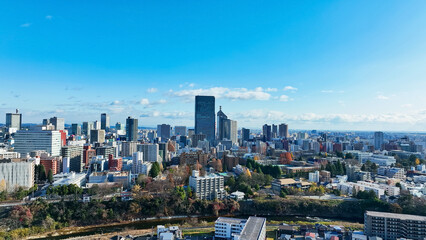 Obraz premium city, landscape, scenery, urban, town, drone, aerial view, society, buildings, construction, panorama, outlook, era, business, blue sky, bird eye view, high angle, horizon, seen from above, looking do