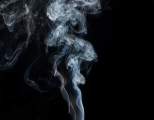 White smoke drifted against the pitch black background, creating a dramatic and mysterious effect