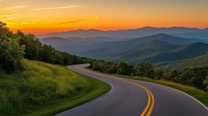 Scenic mountain road at sunset with vibrant sky and lush greenery