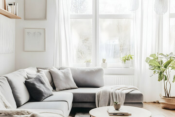 living room with cozy grey sofas positioned near a large window