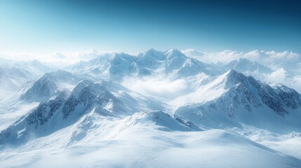 Obraz premium Majestic snow-capped mountain peaks under clear blue sky in serene winter landscape
