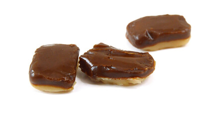 Caramel candies isolated on white background