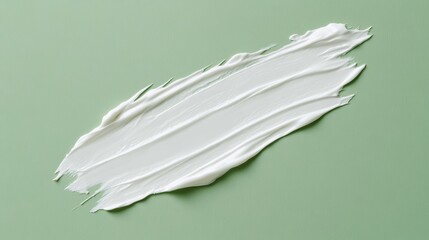 White cosmetic cream texture skincare lotion swatch on green Face creme body moisturizer hair conditioner smear smudge stroke on color background Creamy beauty product close up