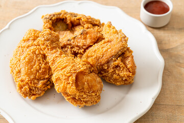 fried chicken with ketchup on plate