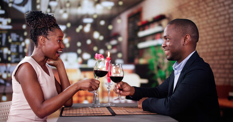 Portrait Of Romantic Couple Toasting Red Wine