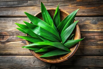 A high-resolution image showcases vibrant pandan leaves in a rustic wooden bowl, atop a weathered wood table.
