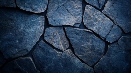 Fototapeta premium Close-up of dark blue slate stone texture with irregular patterns