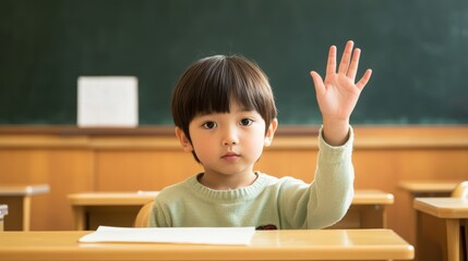 Asian child raising hand in classroom setting