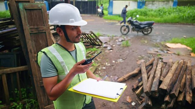 Foreman discussing over radio handset