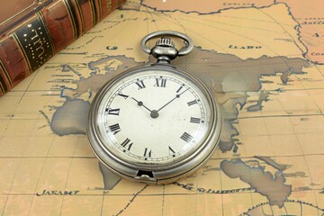 Vintage Pocket Watch Clock, Book, Set Against an Ancient Map Background
