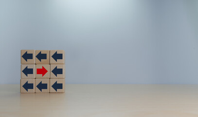 Red arrow goes in the opposite direction of the flow of people