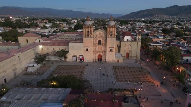 dusk flying clockwise around plaza in front of Templo de Santo Domingo in Oaxaca