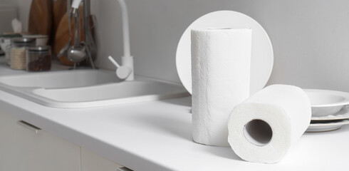Rolls of paper towels on counter in kitchen, closeup