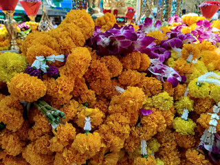 a pile of yellow and purple garland