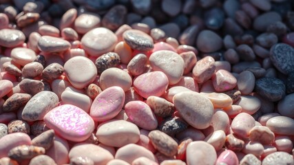 A close-up view of a textured surface covered in smooth, colorful, and varied pebbles, featuring a mix of pink, white, and gray stones, highlighting the natural beauty of the river rocks.