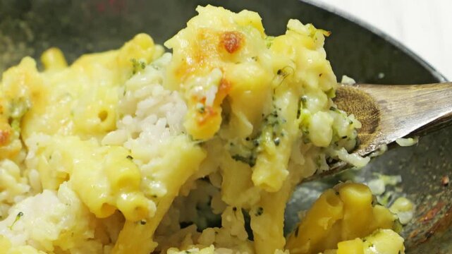 Gratin (doria) made with vegetables, macaroni, cheese and rice. Looks warm and delicious
