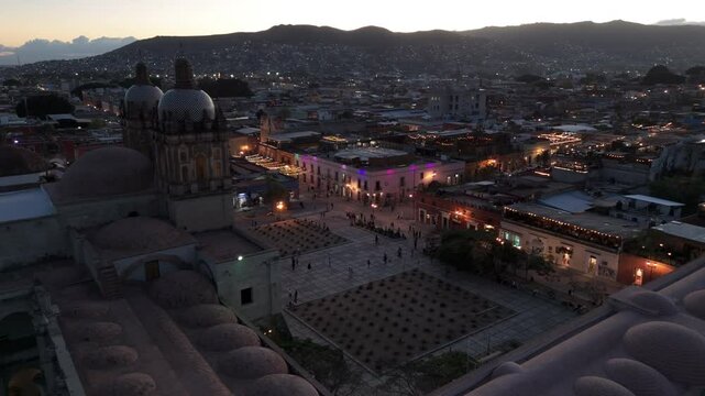 dusk curving around front of Templo de Santo Domingo in Oaxaca