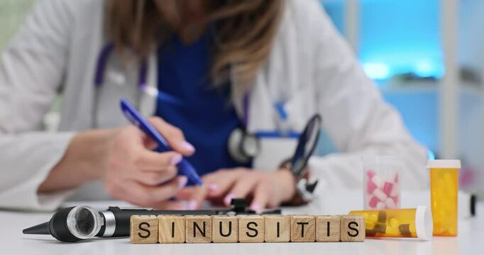 Word Sinusitis of cubes and medical supplies against doctor in hospital. Inflammation of paranasal sinuses diagnostic and treatment concept