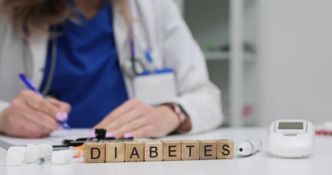 Word Diabetes of wooden blocks with glucometer insulin and sugar cubes in doctor office. Chronical disease awareness in modern hospital