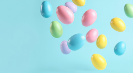 Colorful pastel easter eggs floating on light blue background.