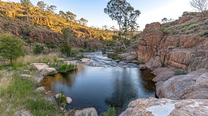 Fototapeta na wymiar Serene Creekside at Sunset: A Rocky Gorge Oasis