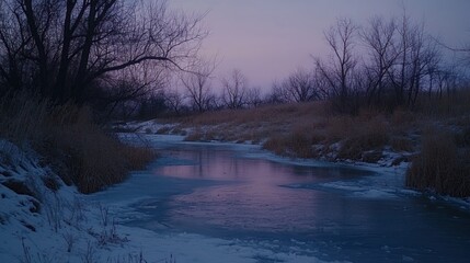 Fototapeta premium Serene Winter Sunset over Frozen Creek
