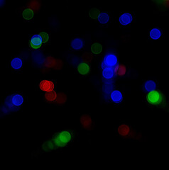 colorful flashes of lights on a black background.