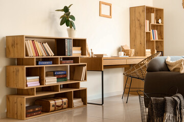 Interior of living room with bookshelves and workplace